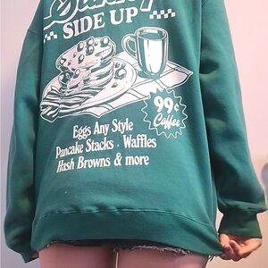 Ardene Green Crew Neck Sweater with Graphic Design